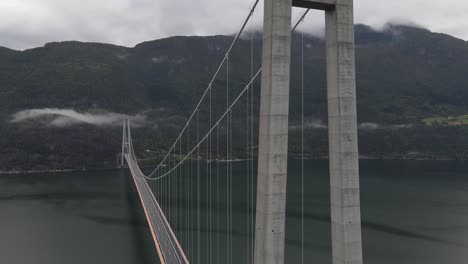 landing drone footage of hardanger bridge - one of the longest suspension bridges in the world