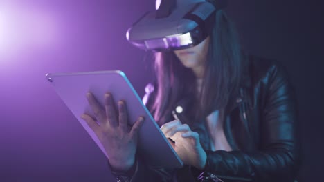 Unrecognizable-woman-in-VR-glasses-browsing-tablet