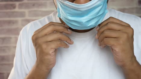 person adjusting a face mask