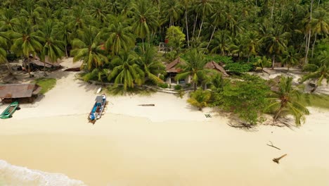 Aerial-view-of-amazing-tropical-island-in-Indonesia-with-turquoise-water-and-beach-small-bungalows