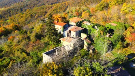 Aerial-4K-drone-video-unveils-the-haunting-beauty-of-Slapnik,-an-abandoned-village-in-Brda,-Slovenia