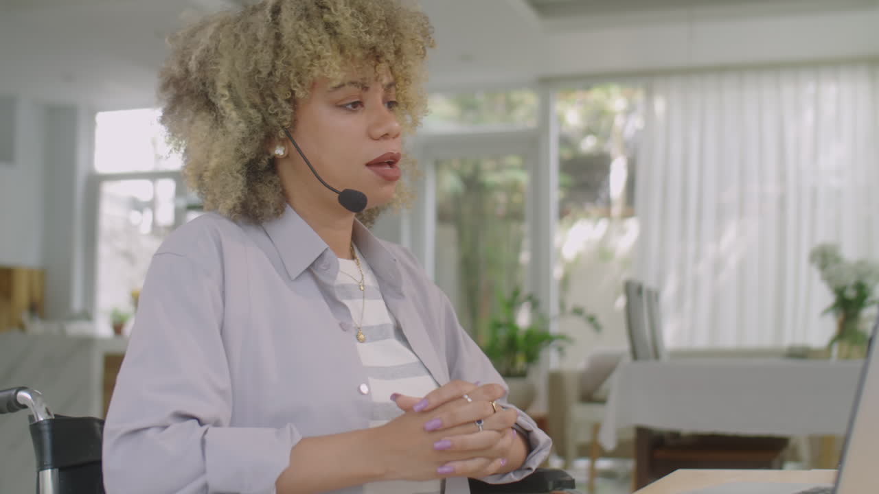 Woman in Wheelchair Having Online Meeting on Web Call