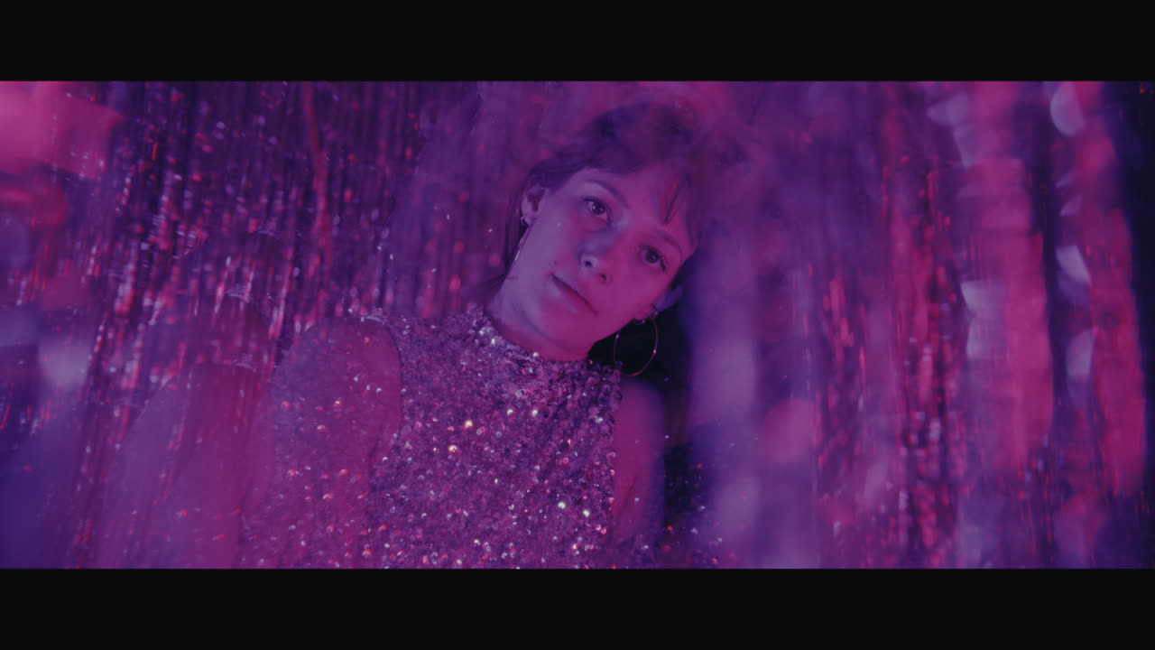 Woman in a Glittery Purple Dress