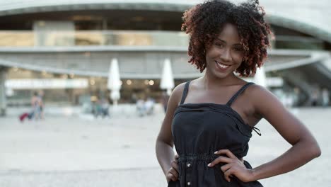 beautiful smiling woman posing on street