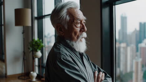 elderly man contemplating city view