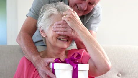 old man offering a gift