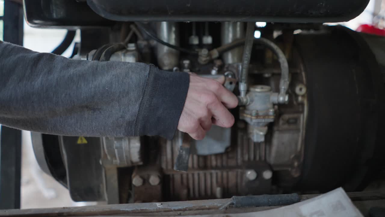 Mechanic Inspecting an Engine