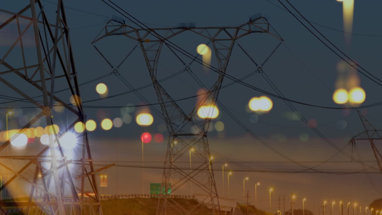 Road traffic in city at night with electricity pylons 4k