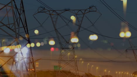 road traffic in city at night with electricity pylons 4k