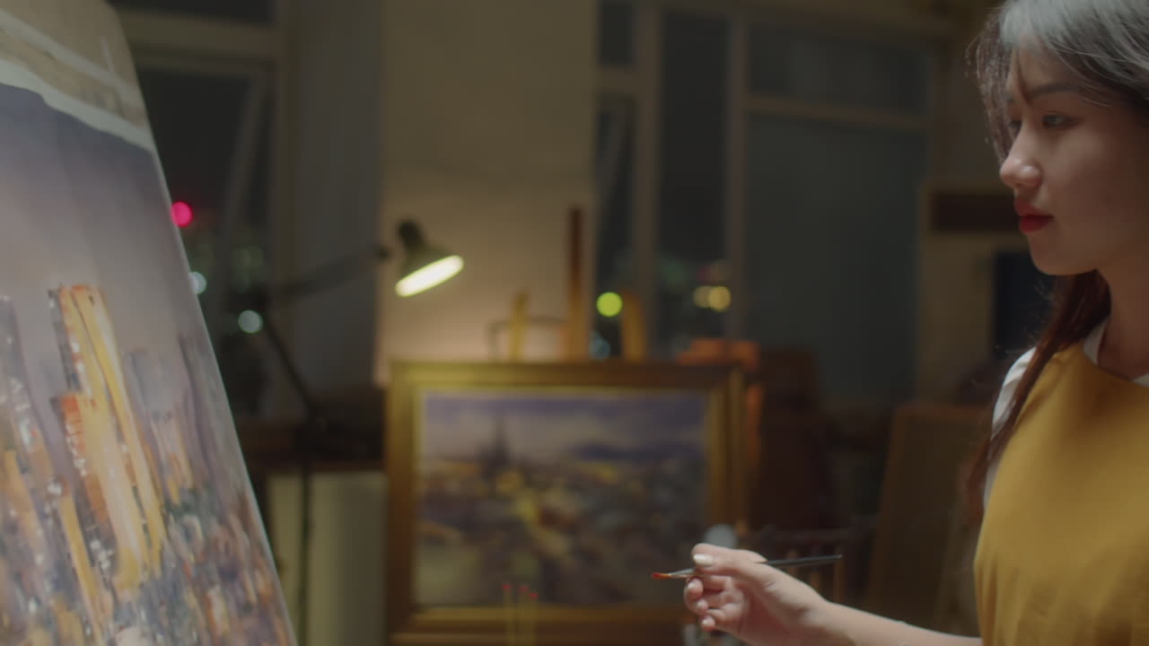 Asian Female Artist Painting Night City Panorama on Canvas