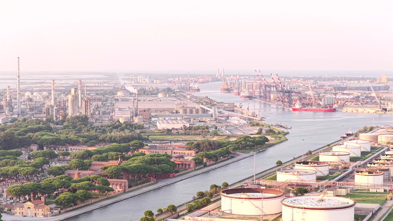 Nice aerial view of industrial and port area of Ravenna,production district is made up of a chemical and petrochemical pole, thermoelectric and metallurgical plants at sunset