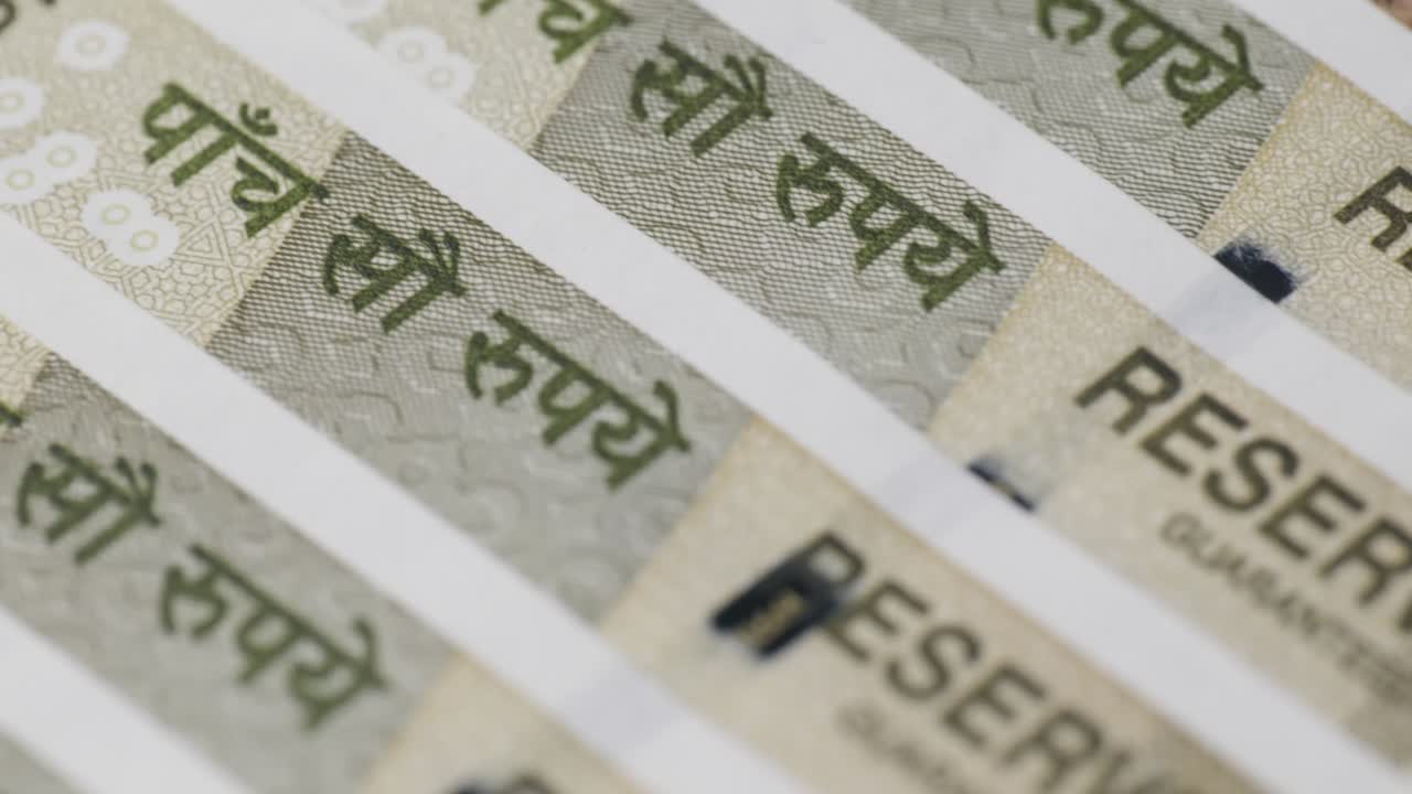 five hundred rupees notes close up shot, Reserve bank of india print in english and hindi with Security Thread , macro, push in shot, 4k.