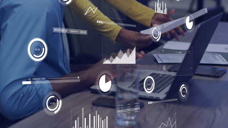 animation of financial data processing over diverse colleagues discussing work in office