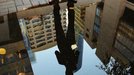 Reflection-of-a-businessman-in-the-puddle