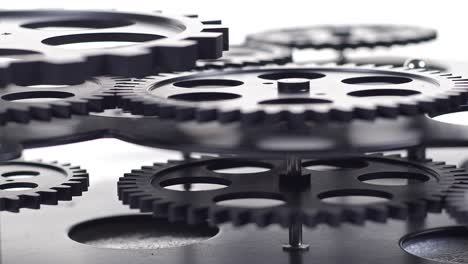 close up shot of  black gear cogs rotating