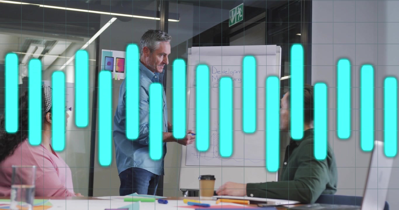 Team leader writing headings on flip chart and drawing colored bar chart grid for business planning