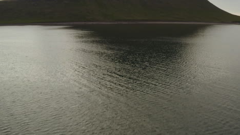 Tilt-up-Reveal-Of-The-Famous-Kirkjufell-Mountain-On-The-North-Coast-Of-Snaefellsnes-Peninsula-In-Iceland