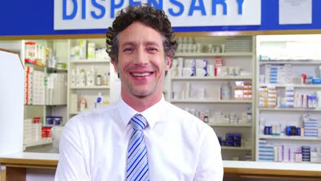 pharmacist standing with arms crossed