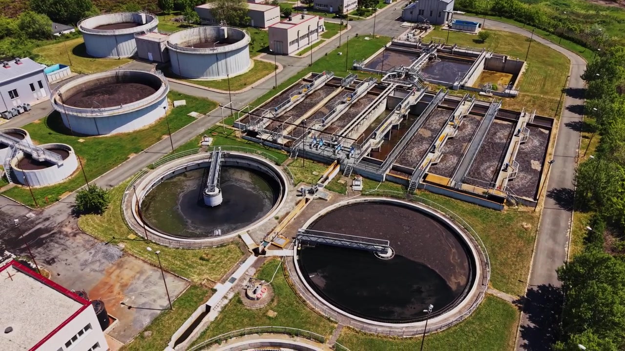 View of a wastewater treatment facility near a green area