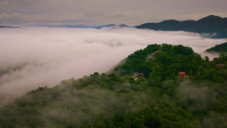 atmospheric drone shot of clouds creeping through the smokies