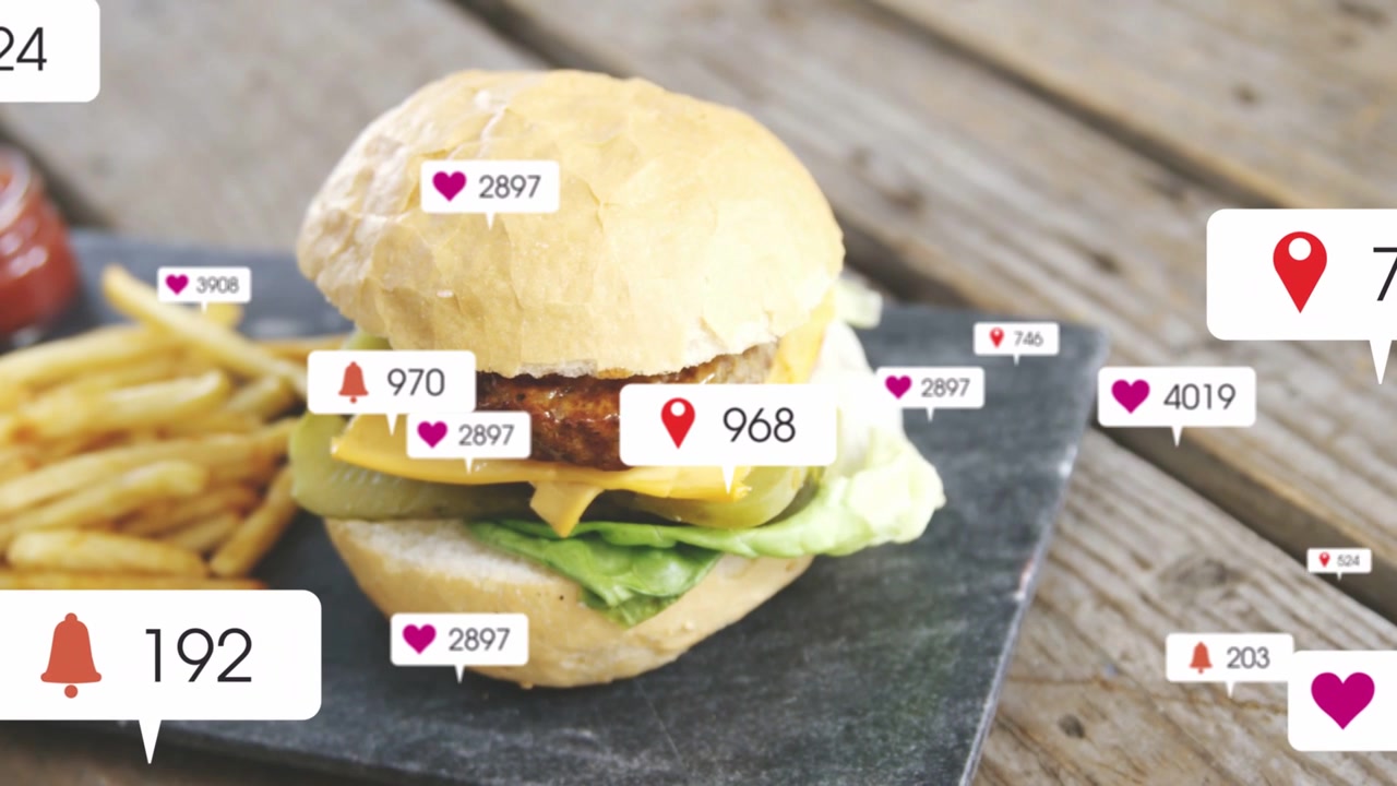 Social Media Notifications Appearing on a Cheeseburger and Fries