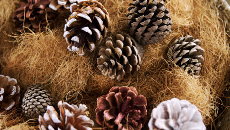 pine cones and straw arranged during christmas time 4k