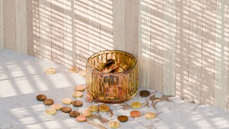 golden coins in a glass jar