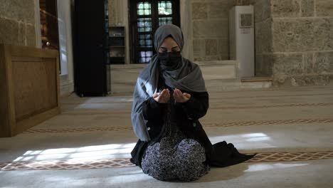 masked muslim woman praying footage