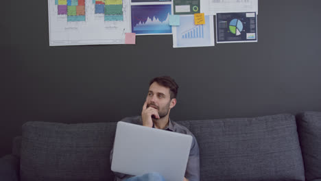 Male-executive-working-on-laptop-in-a-modern-office-4k