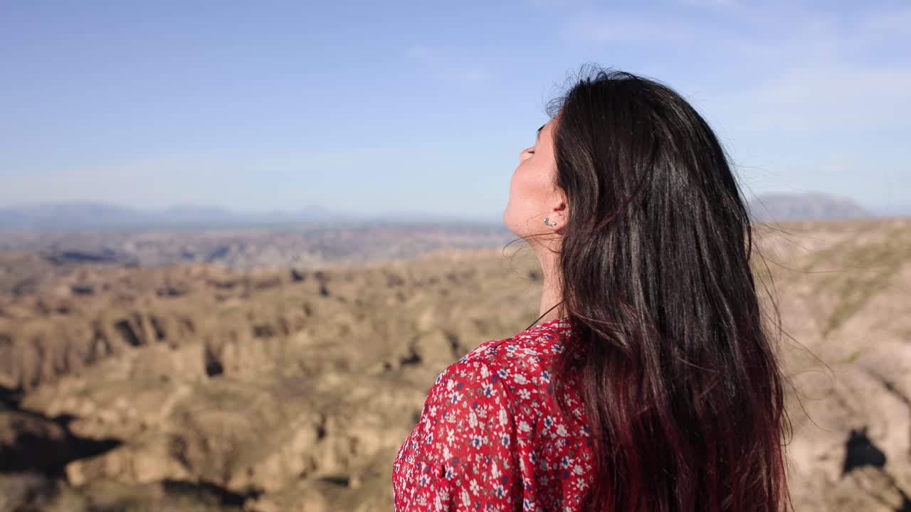 A woman enjoying the vast natural landscape