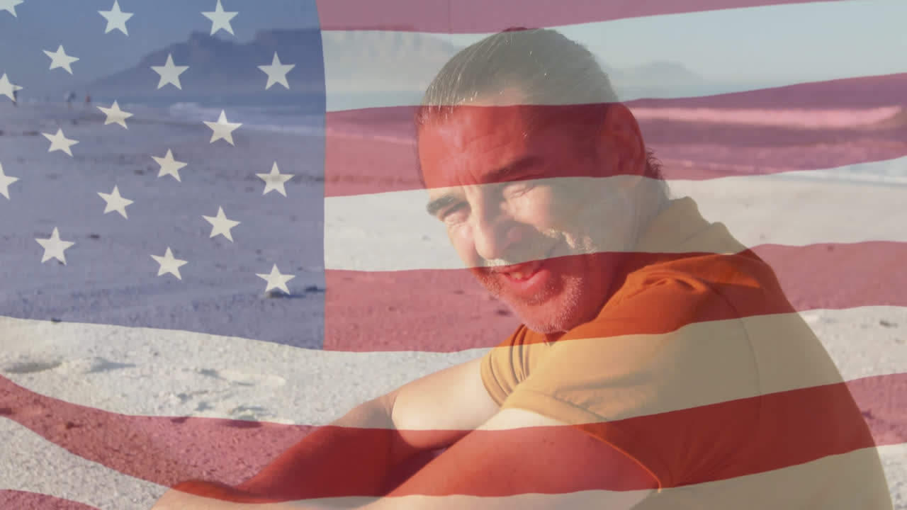 Animation of american flag waving over senior man smiling on beach