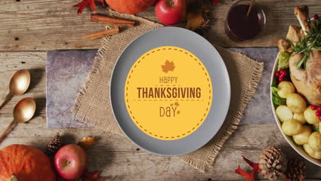 animation of happy thanksgiving text and place setting over wooden background