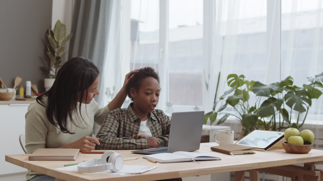 Mother and Son Doing Online Learning at Home