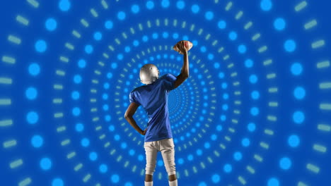 animation of african american male american football player with ball over shapes