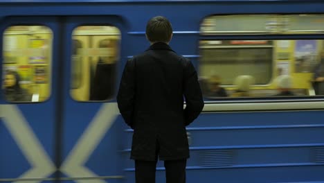 person waiting for subway train