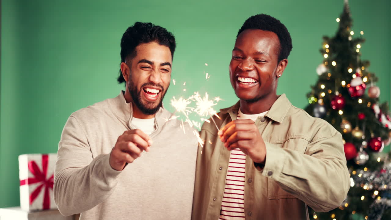 Two men celebrating Christmas with sparklers