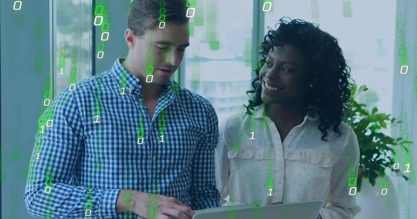 Man typing on laptop and woman pointing at screen while green binary code driving IT analysis