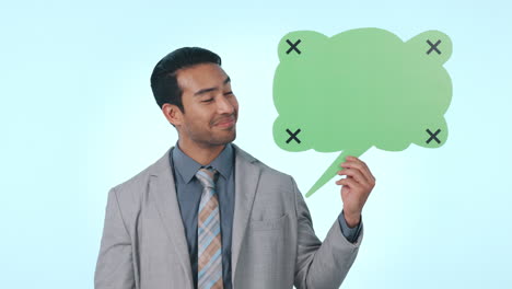 business man, speech bubble and point in studio