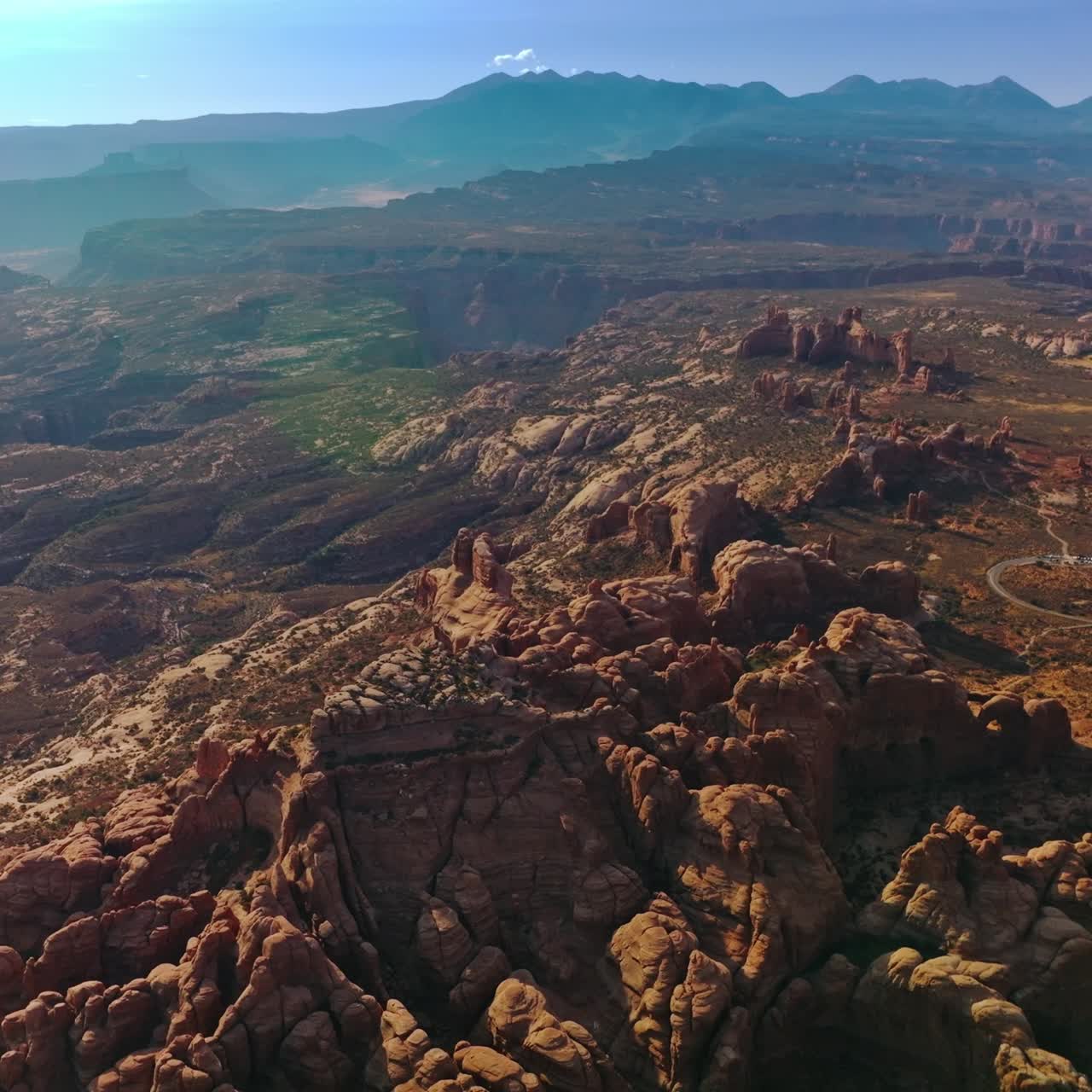 Rising over the stunning scenery of rock formations in Utah, USA. Sunny panorama of beautiful canyons under blue skies. Top view