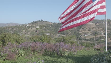 american flag flying high over fallbrook, california mountains