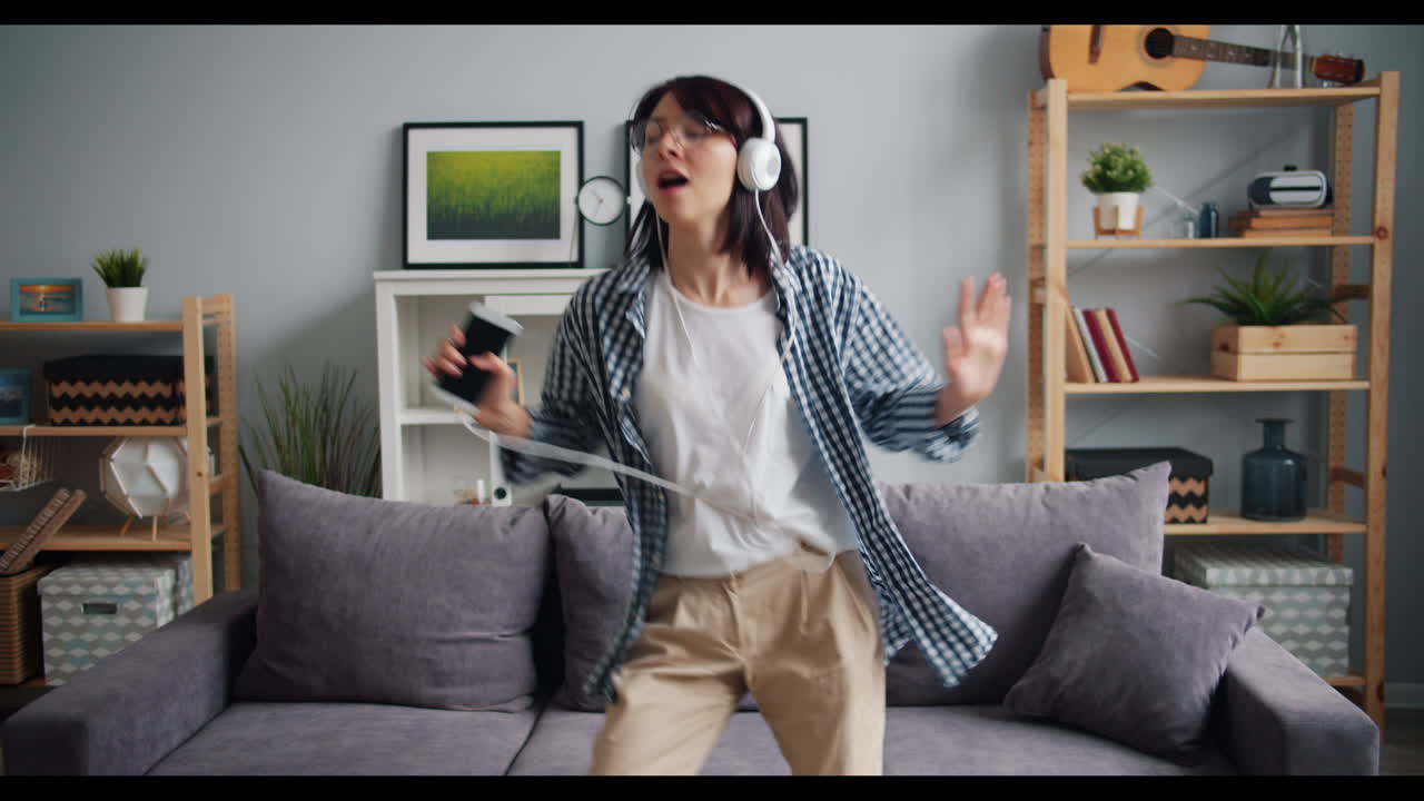 Woman Dancing in Living Room to Music