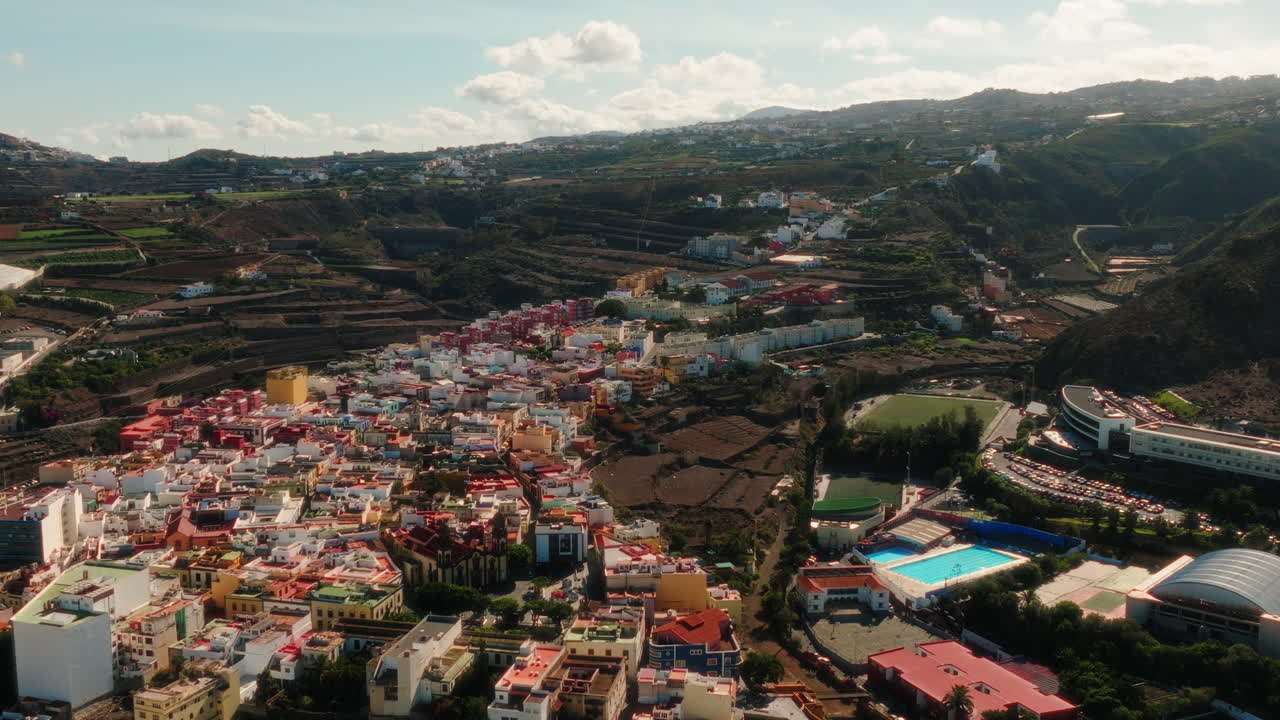 Aerial: cityscape of Las Palmas during the day in Gran Canaria, Spain, establishing drone shot
