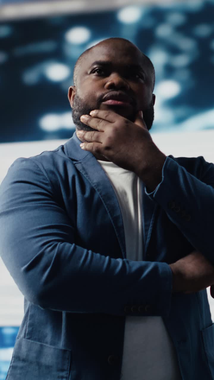 Thoughtful African American Man Standing in Modern Office