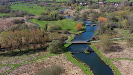 Aerial-flying-away-Longstock-Sunny-Day-UK-4K