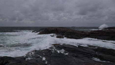 rough sea pounds shore in western norway