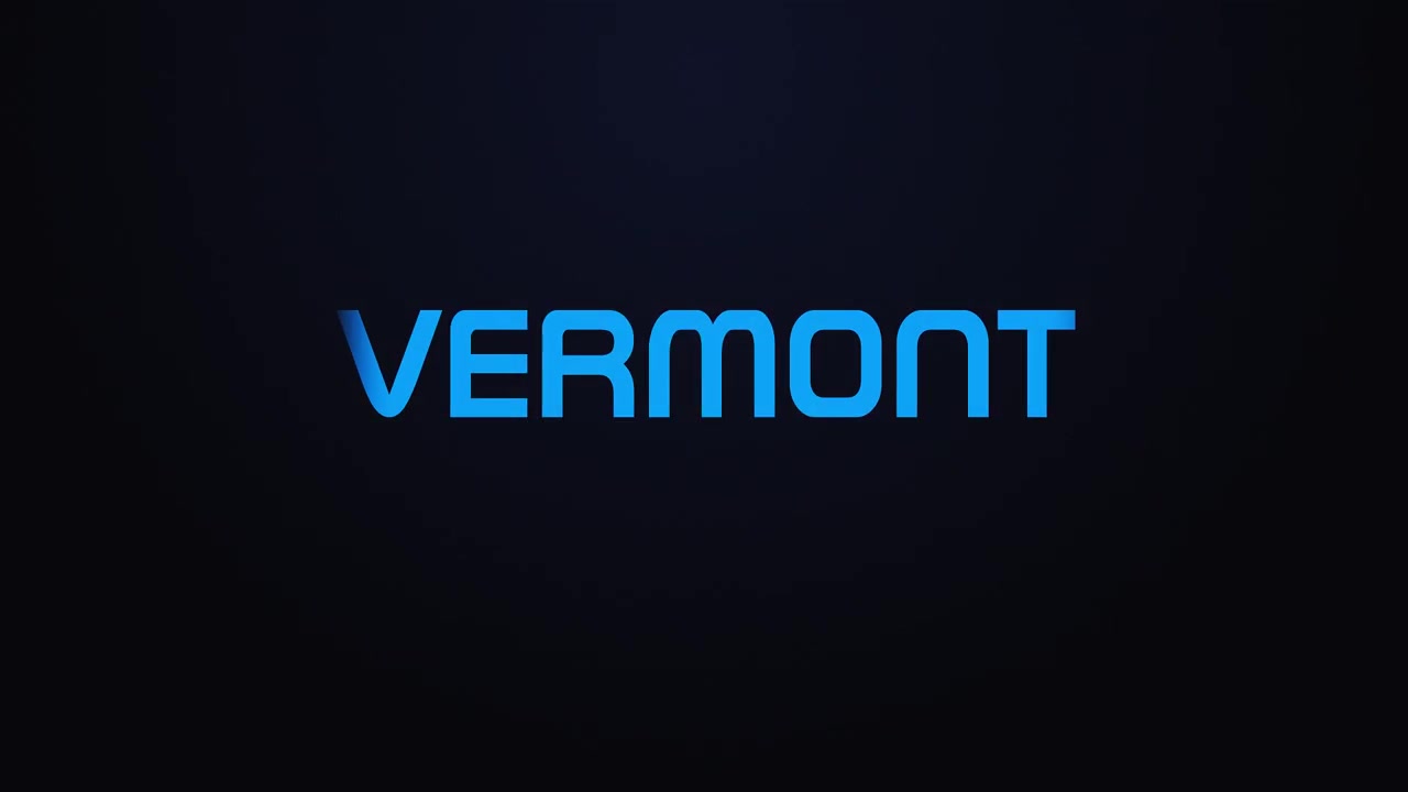 Glødende eksplosion, der afslører teksten VERMONT i blå og pink.