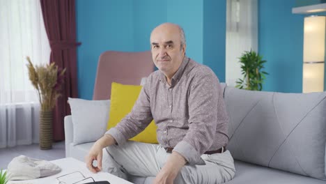 Elderly-man-making-negative-gesture-at-camera.