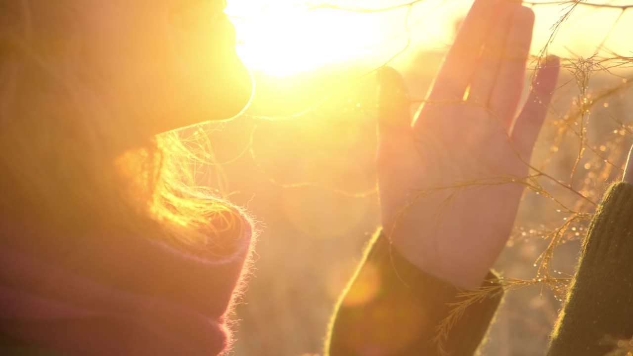 Woman enjoying a beautiful sunset