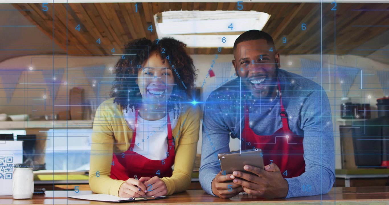 Vertical video: Blue overlay drifting two in red aprons scrolling tablet holding pen at counter