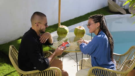 Couple-sitting-on-a-terrace